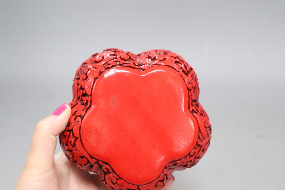 A Chinese cinnabar style box in the form of a fruit, height 12cm